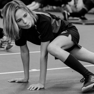 child in pe black and white