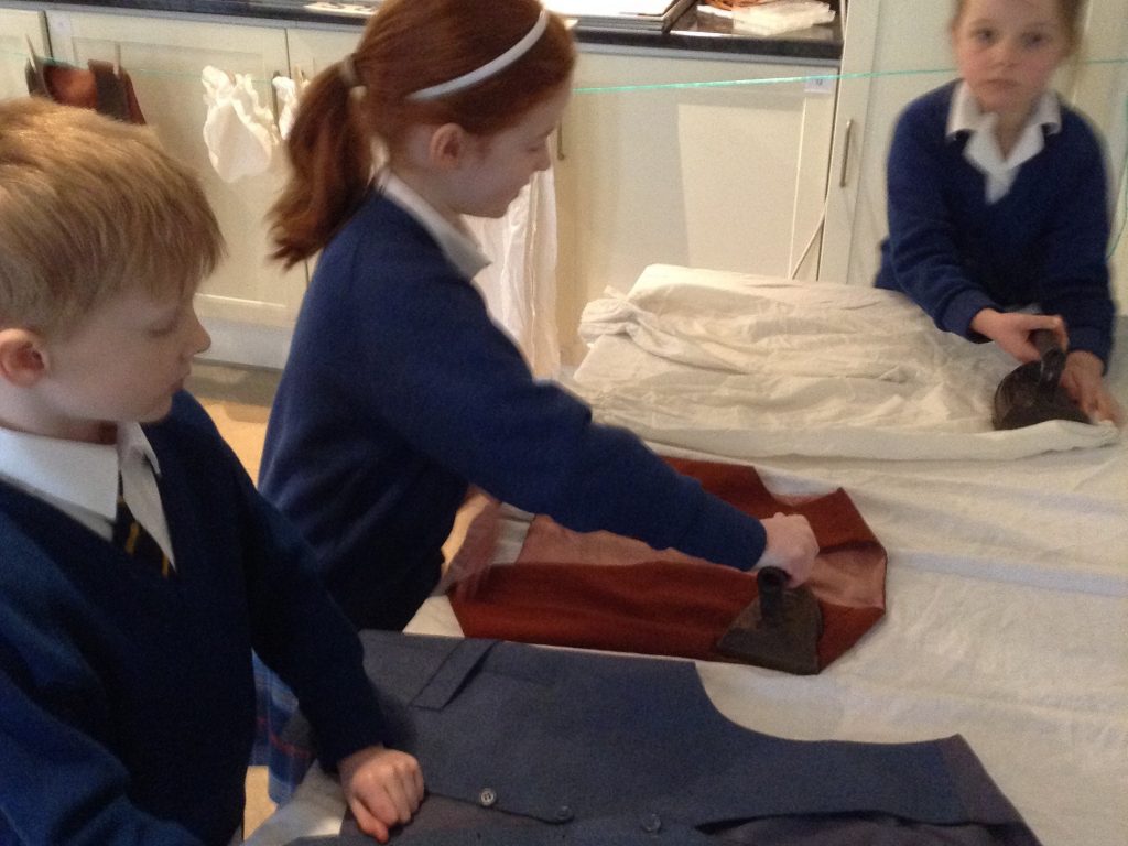 students ironing clothes