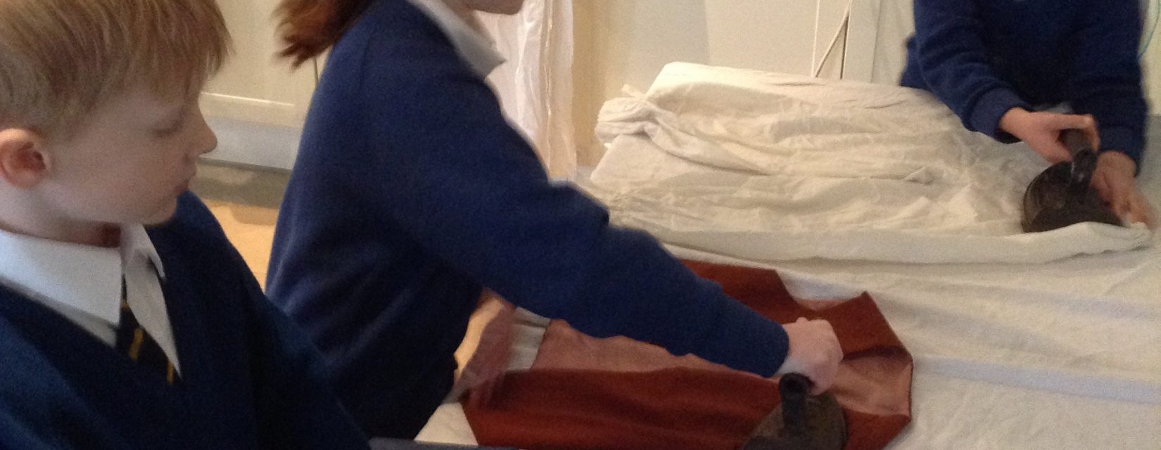 students ironing clothes