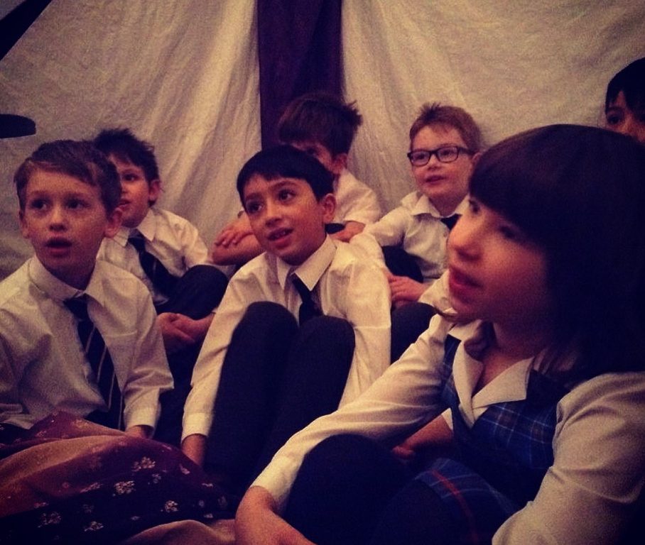 students sat for story time in the dark