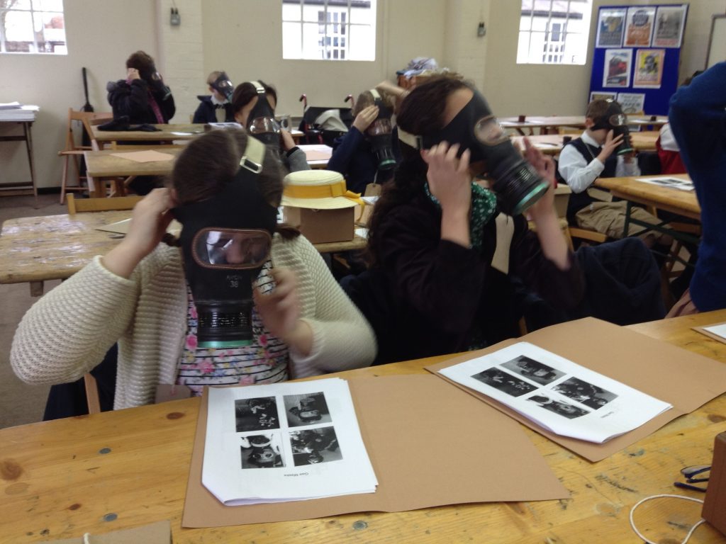 students wearing gas masks