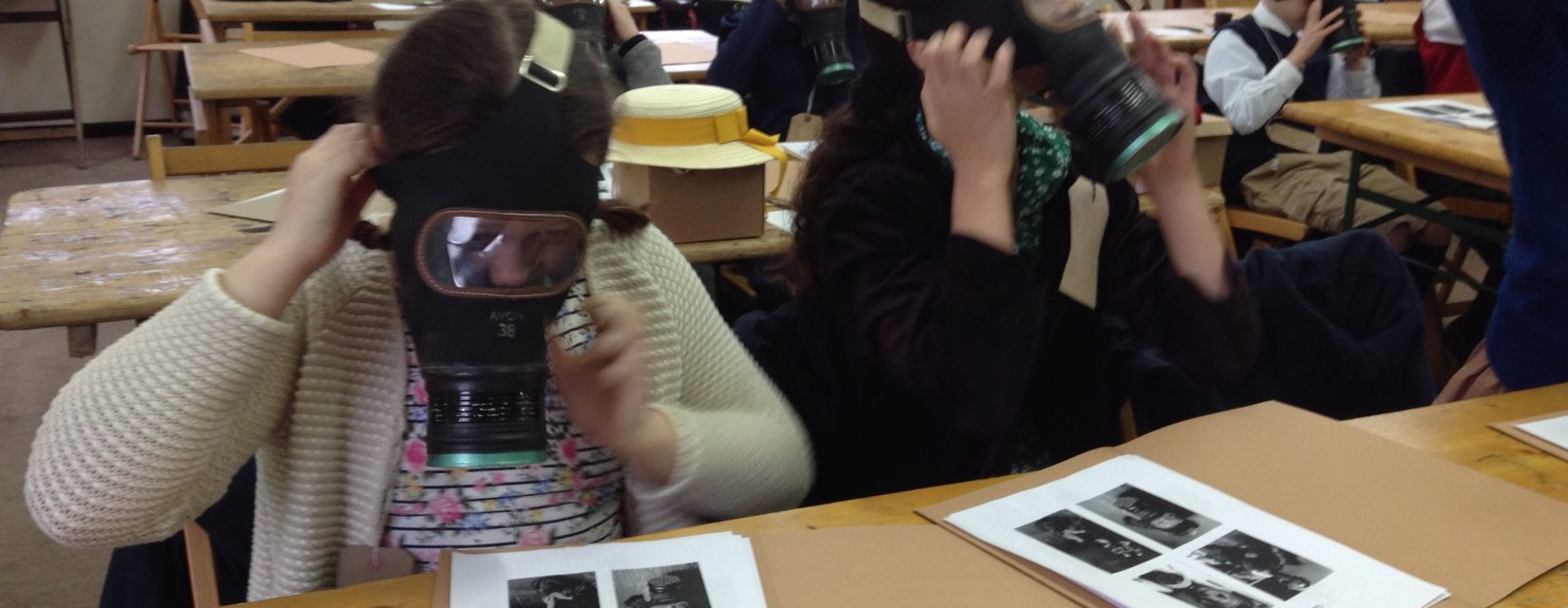 students wearing gas masks
