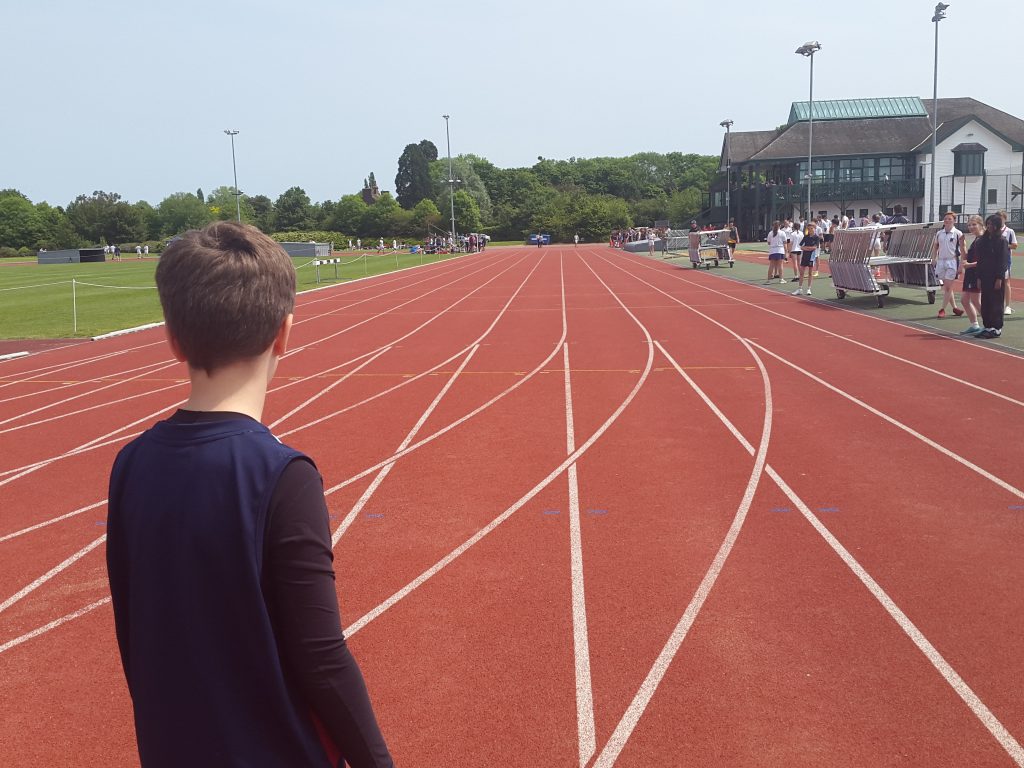 student on a running track