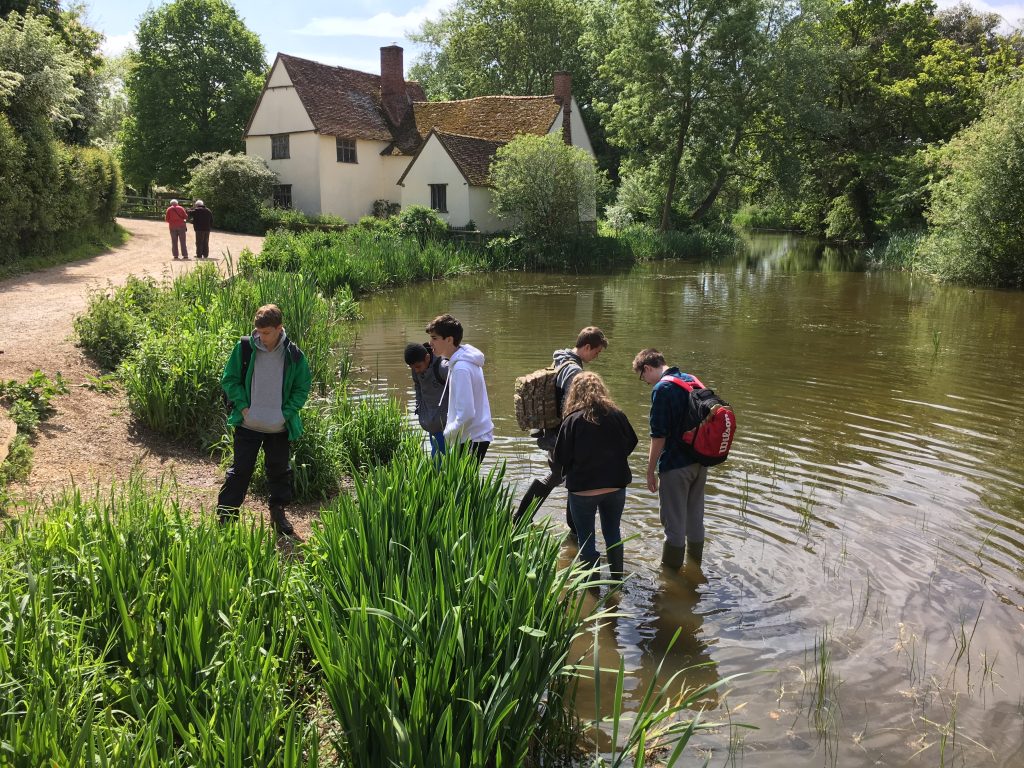 Young students in a lake