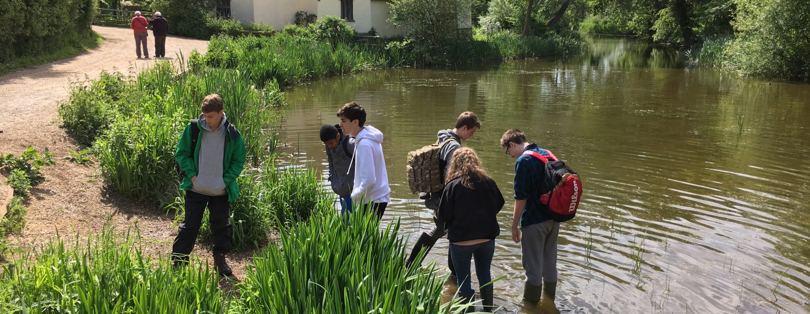 Young students in a lake