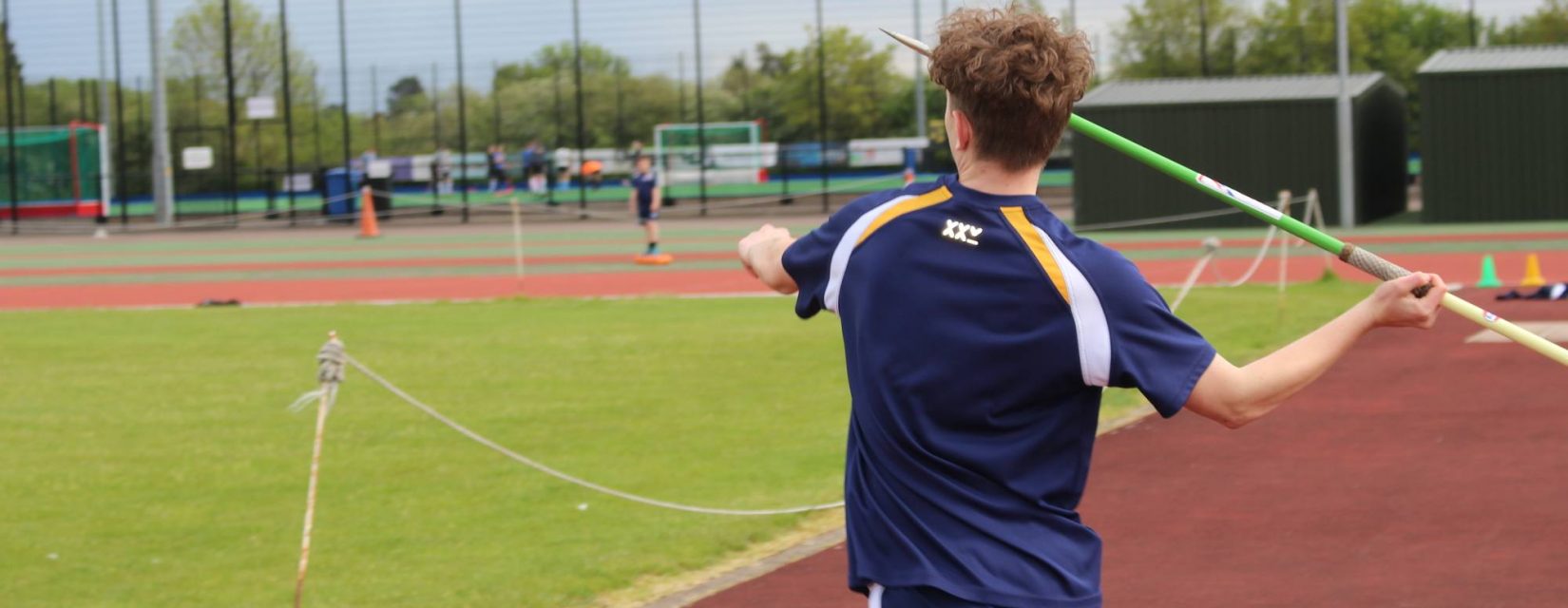 student throwing a javelin