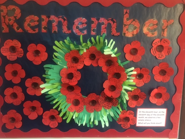 a poppy wreath added onto the wall in school