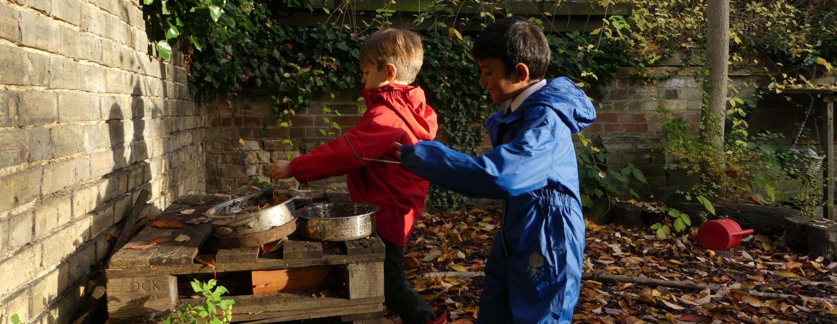children with pots and pans outside