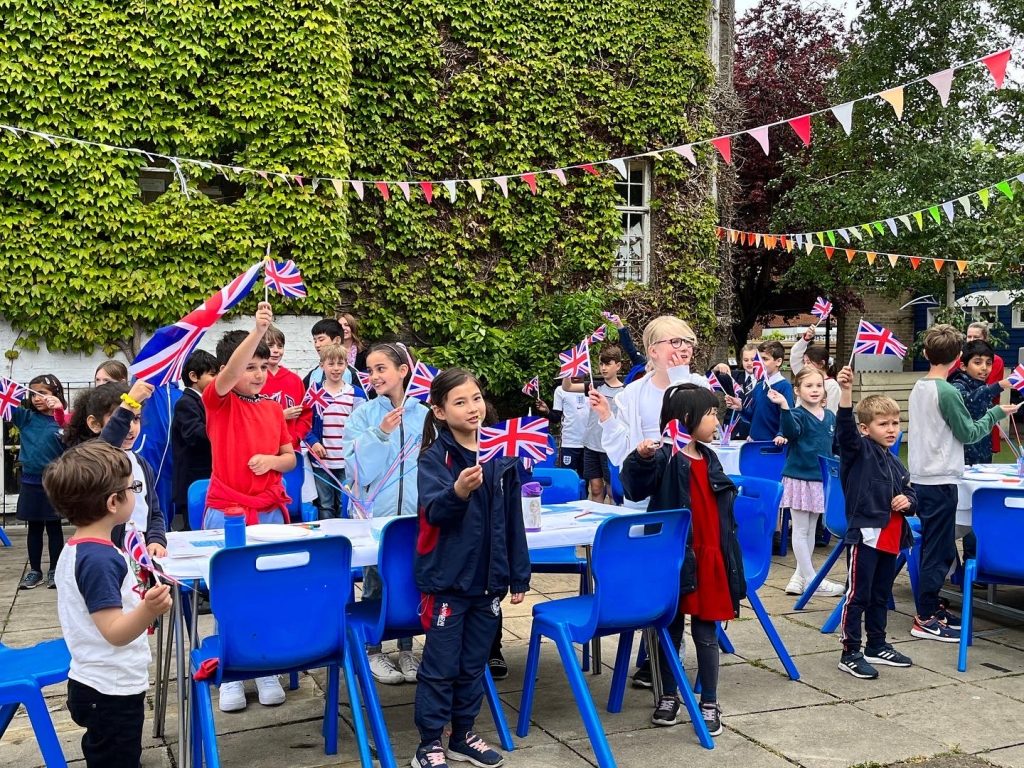 children holding union jack flags