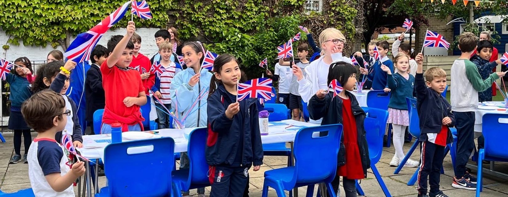 children holding union jack flags