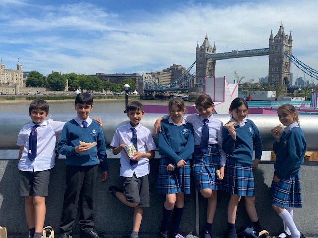 children standing infront of Tower Bridge