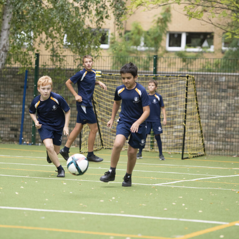 students playing football