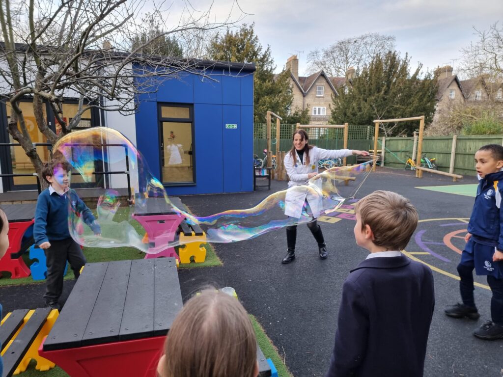 students looking at a big bubble