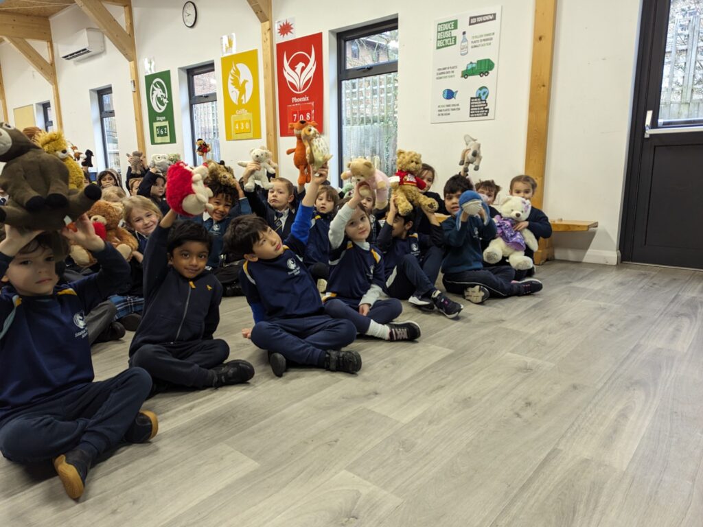 students holding stuffed animals