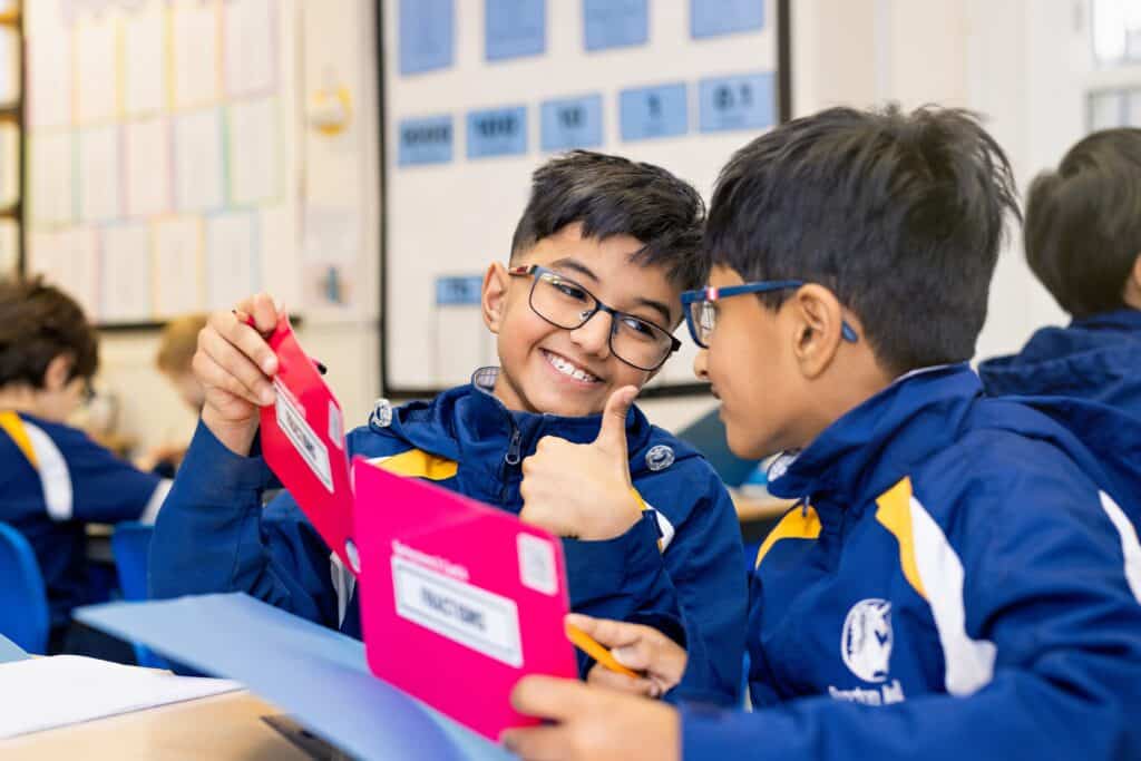 Two Santon Wood pupils celebrating together