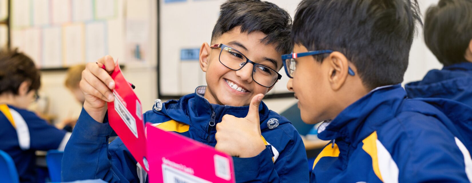 Two Santon Wood pupils celebrating together