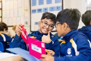 Two Santon Wood pupils celebrating together